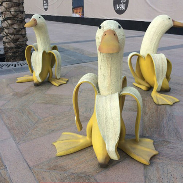 Statuette decorative a forma di anatre banana