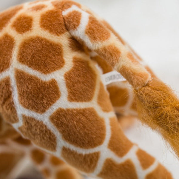 Pupazzo di peluche a forma di giraffa